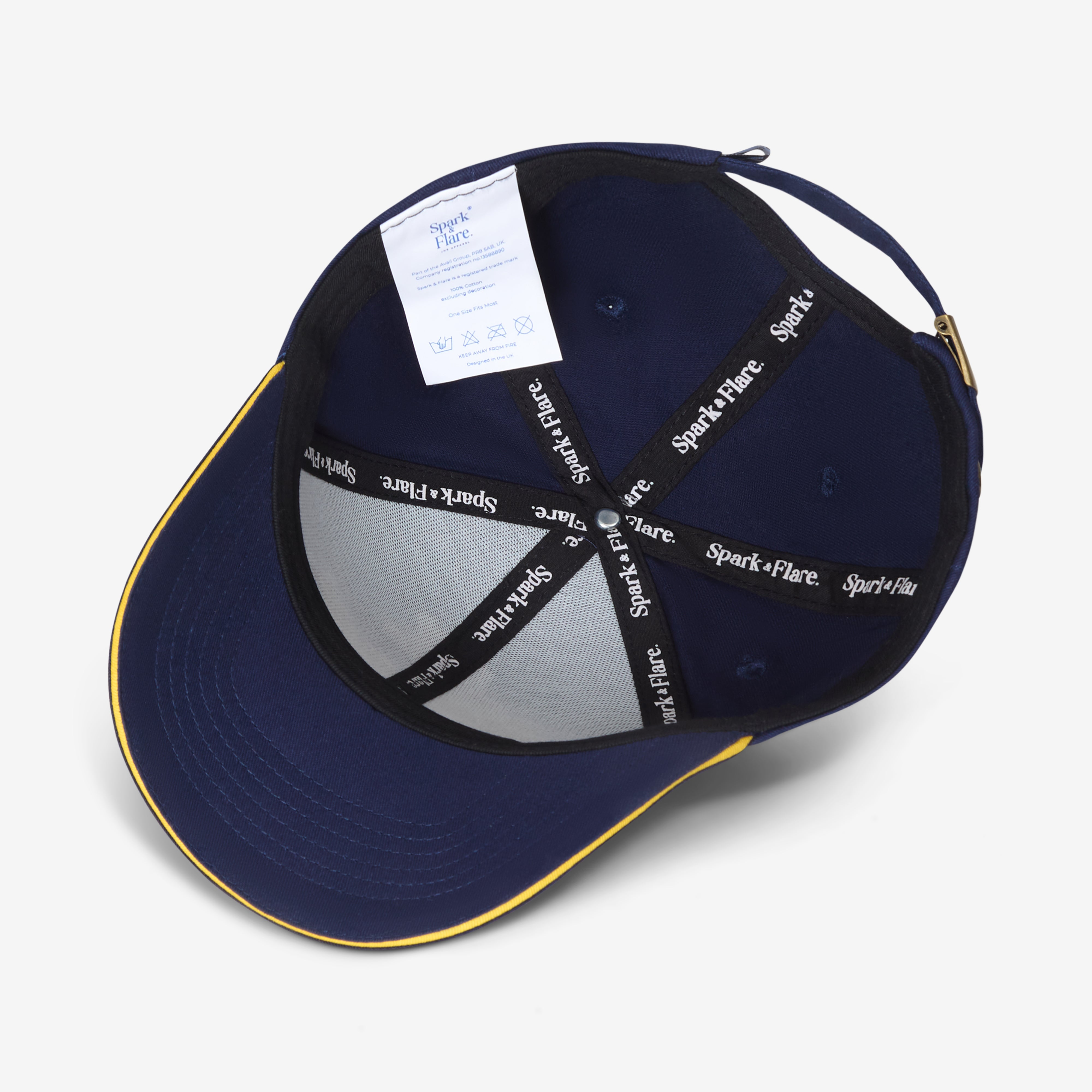 Inside of a Navy Spark & Flare Baseball cap with gold trim and branded lining