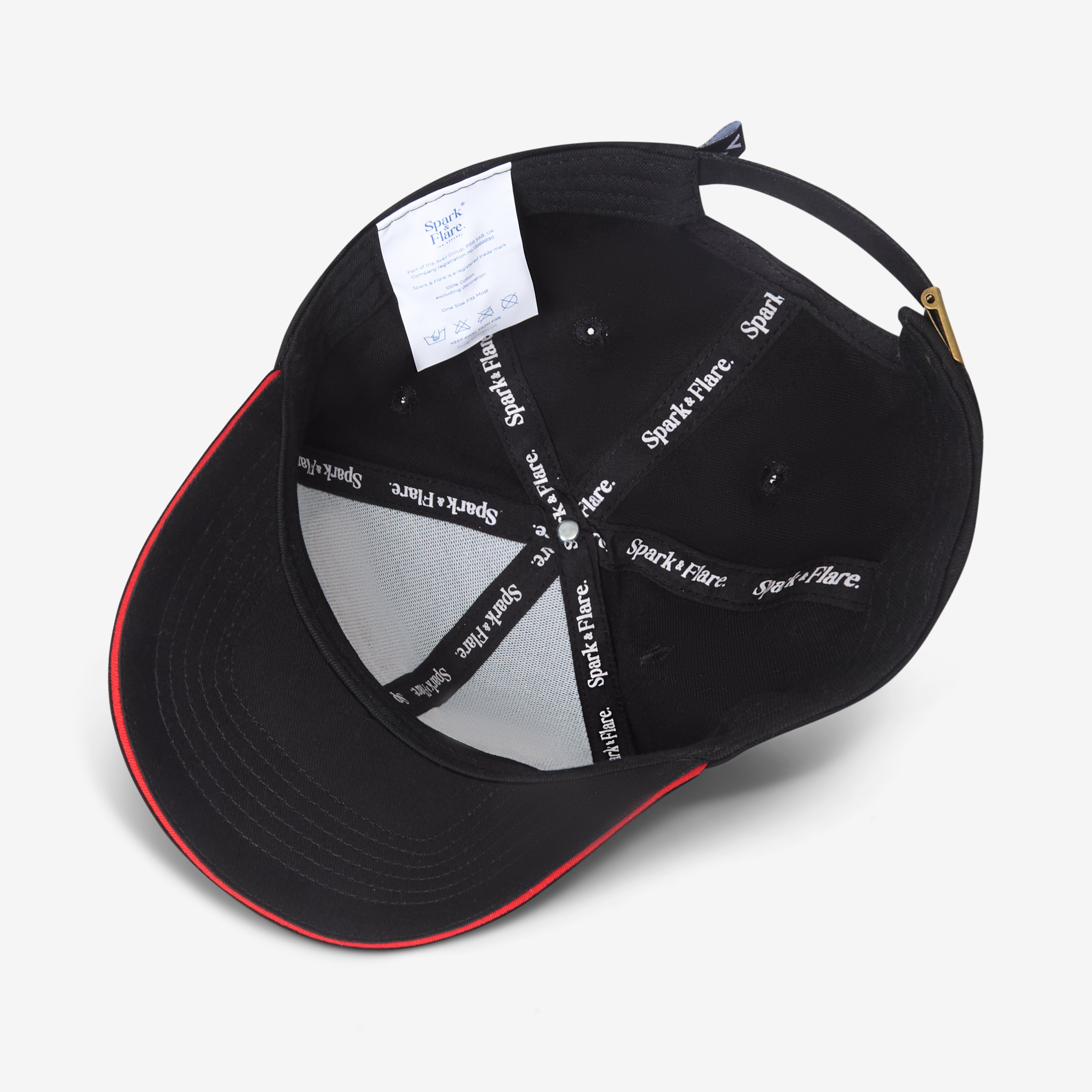 Inside of a Black Spark & Flare Fearless baseball cap with red trim and branded lining