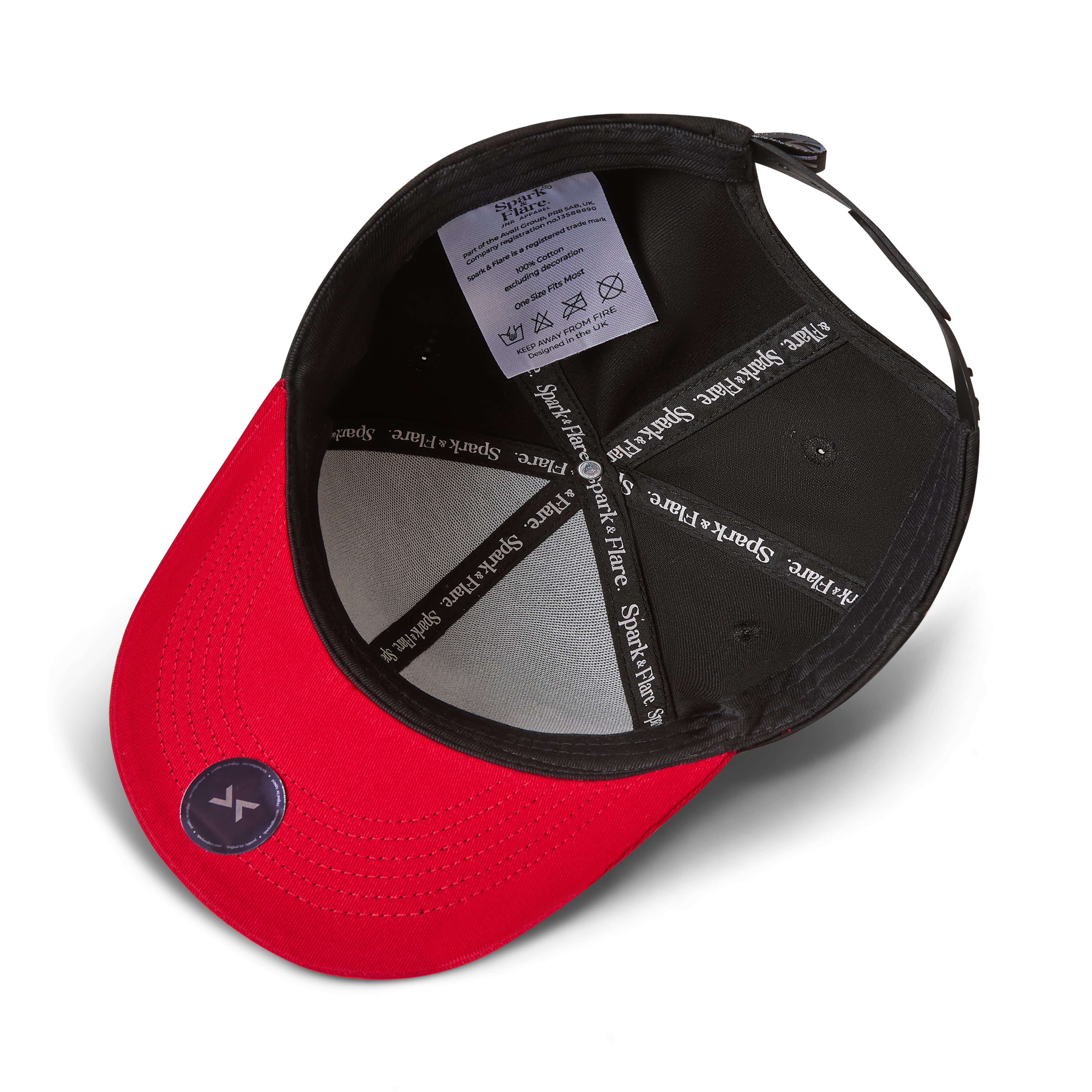 Inside view of a black baseball cap with a small red button on top and a black adjustable strap with a authenticity sticker and Spark & Flare branded lining, shown on a white background.