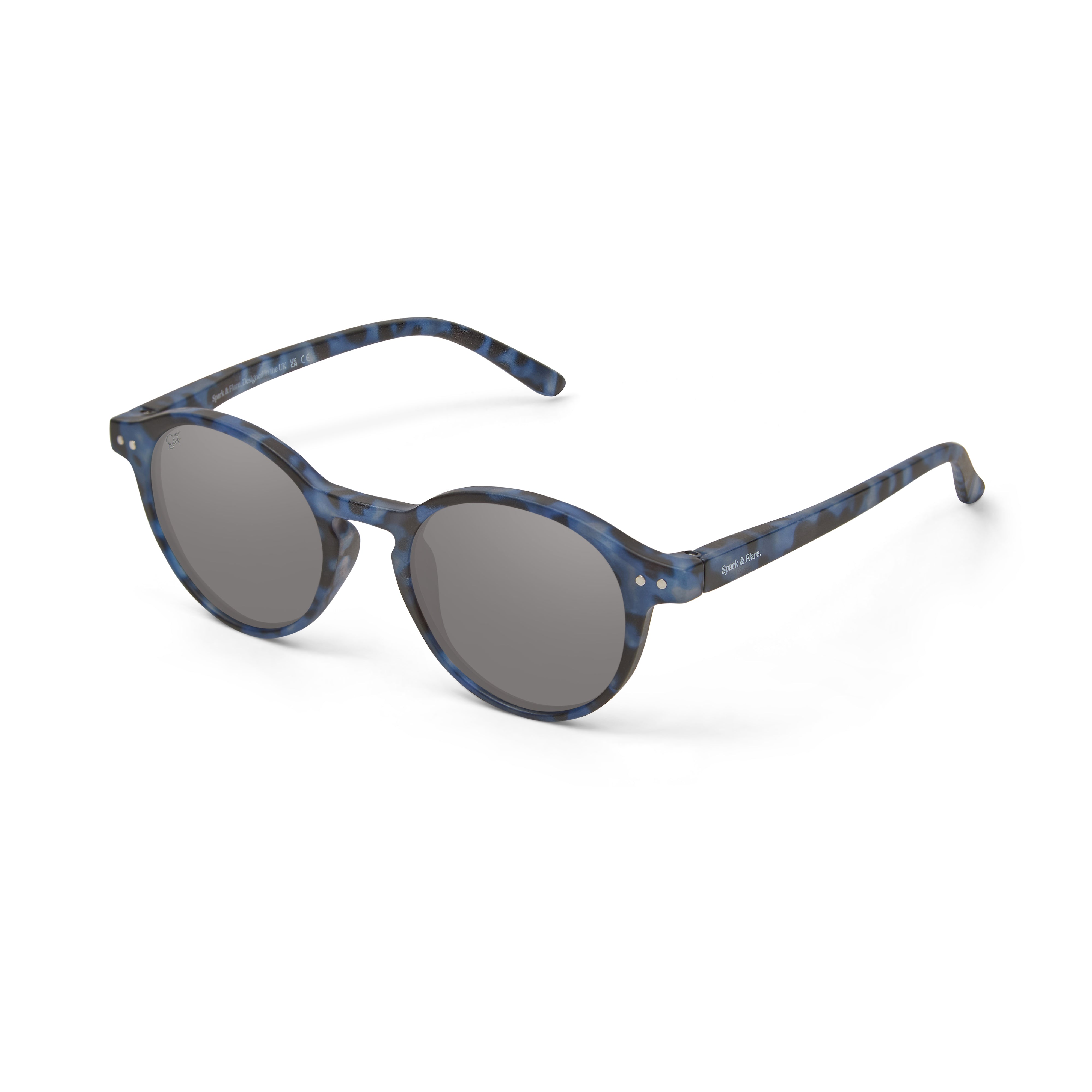 Oval sunglasses with a blue and black tortoiseshell patterned frame and dark gray lenses, shown on a clean white background.