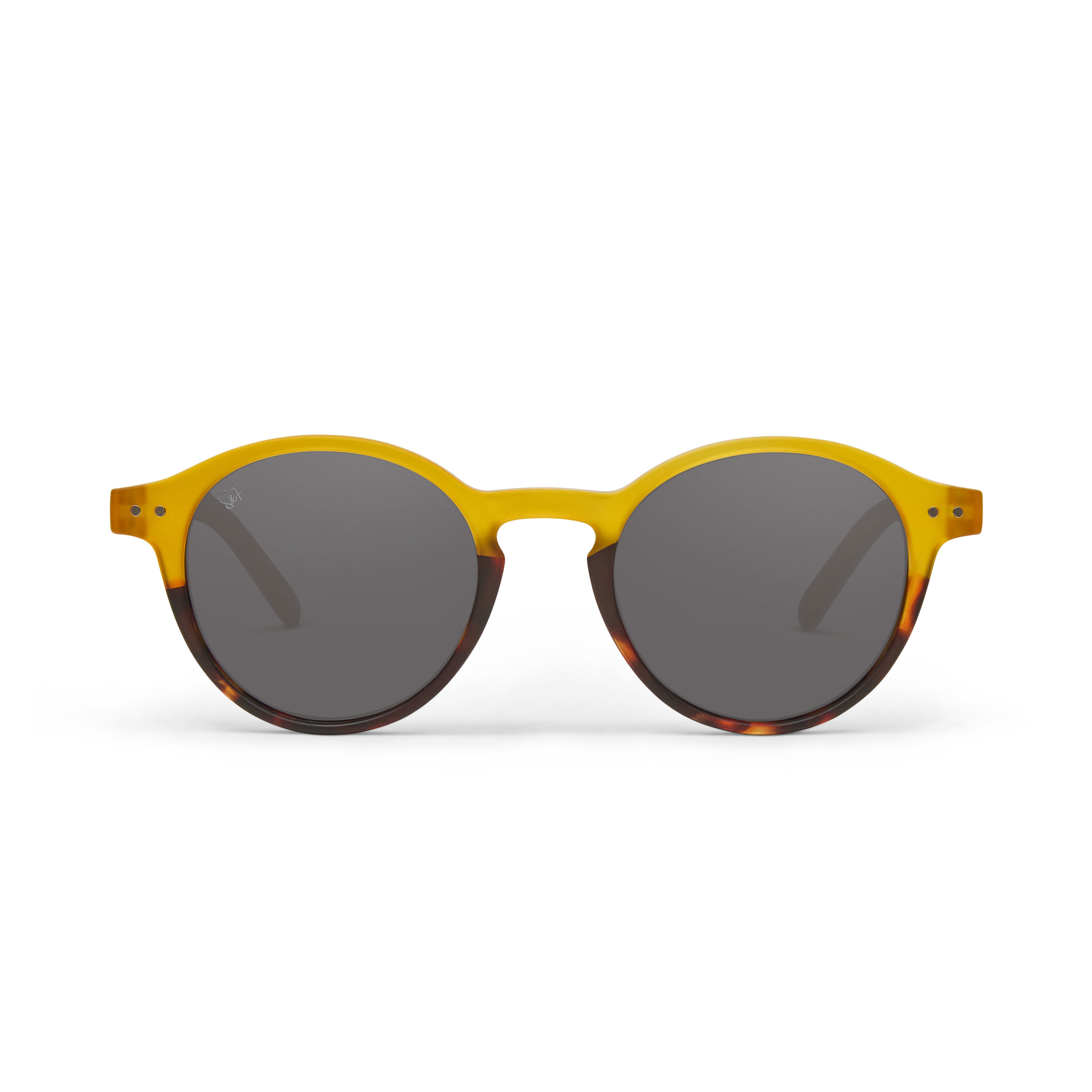 Round sunglasses with a translucent yellow acetate frame, dark grey lenses, and a tortoiseshell pattern on the lower frame edges, shown against a plain white background.