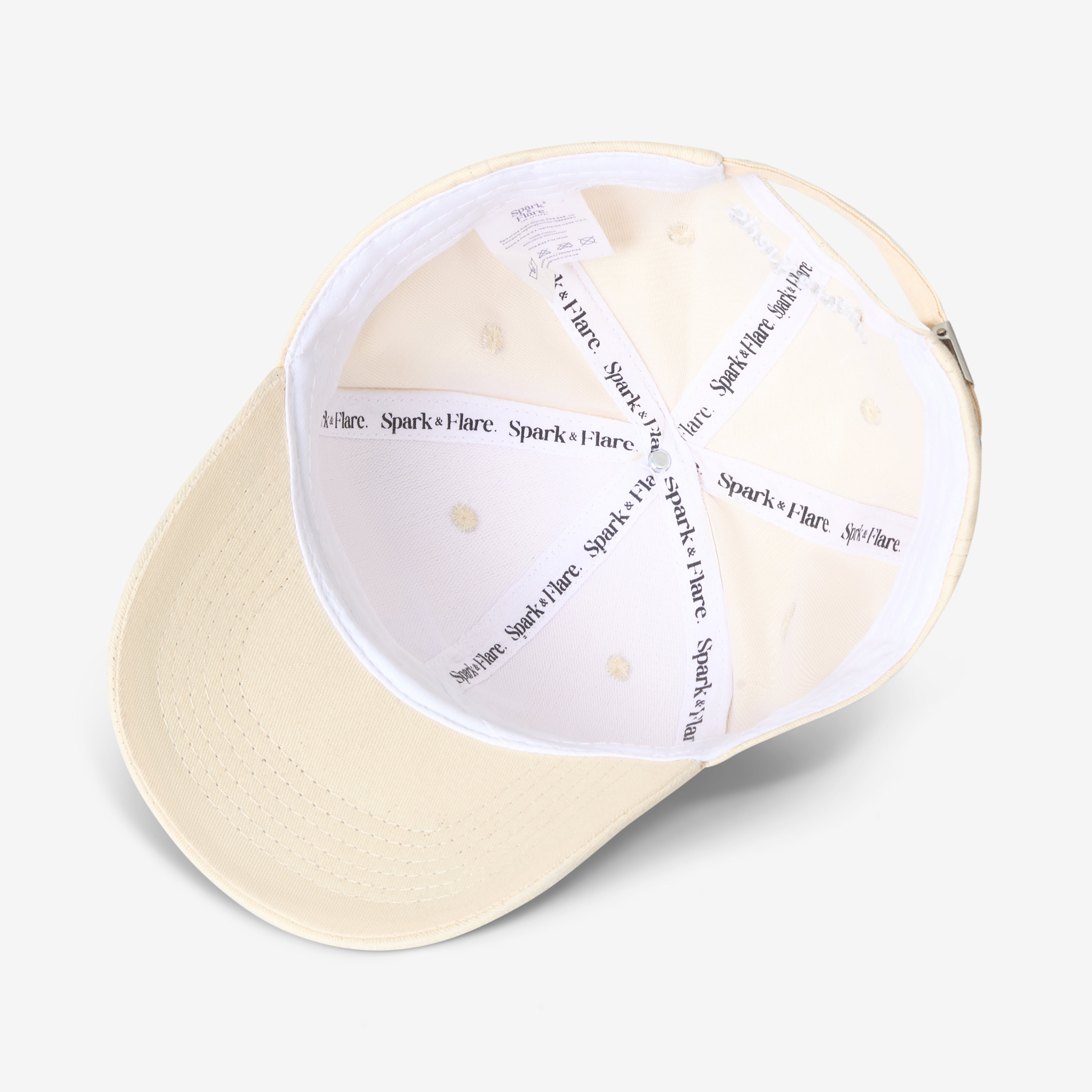 Inside a Beige cap with Spark & Flare branded lining