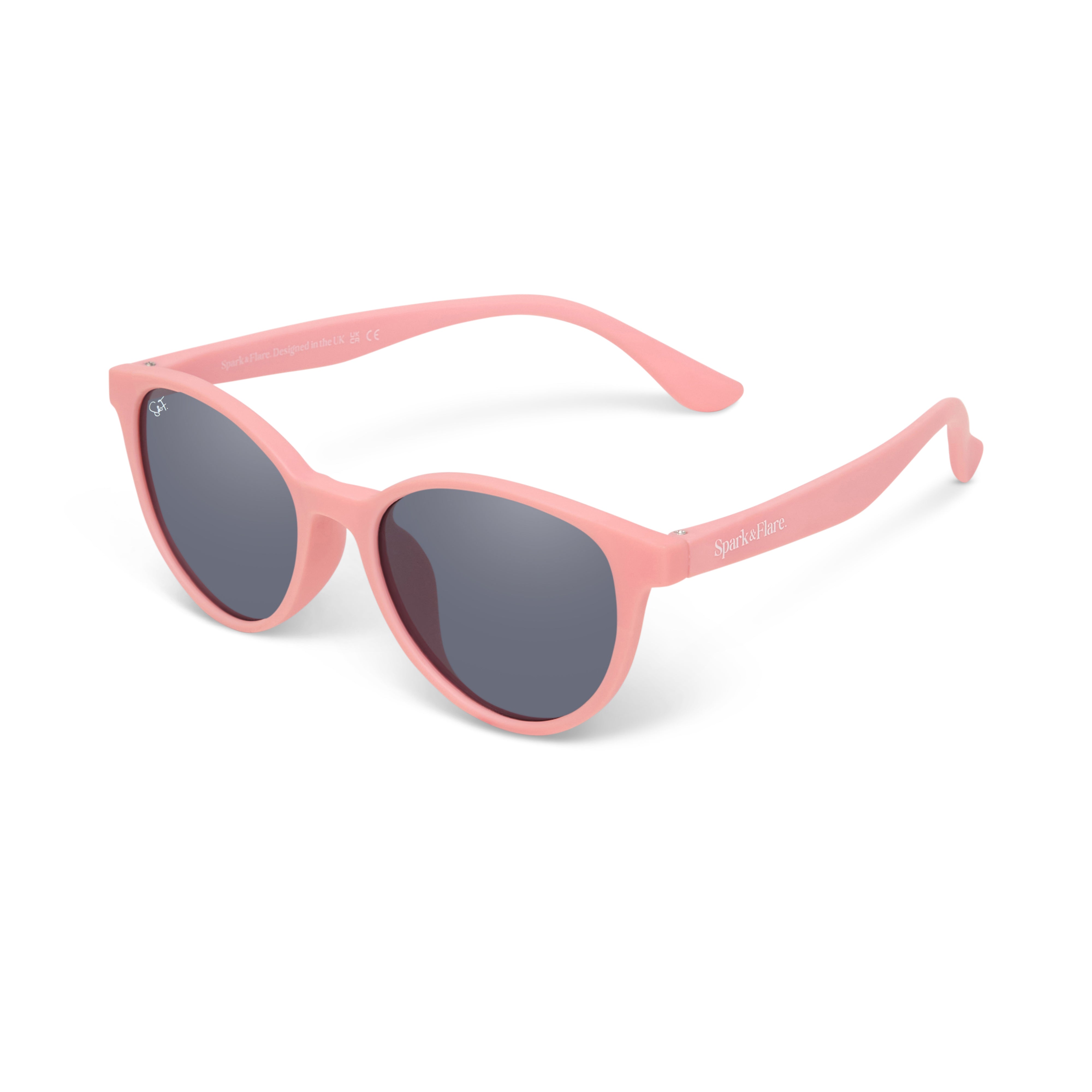 Pink sunglasses with dark lenses on a white background