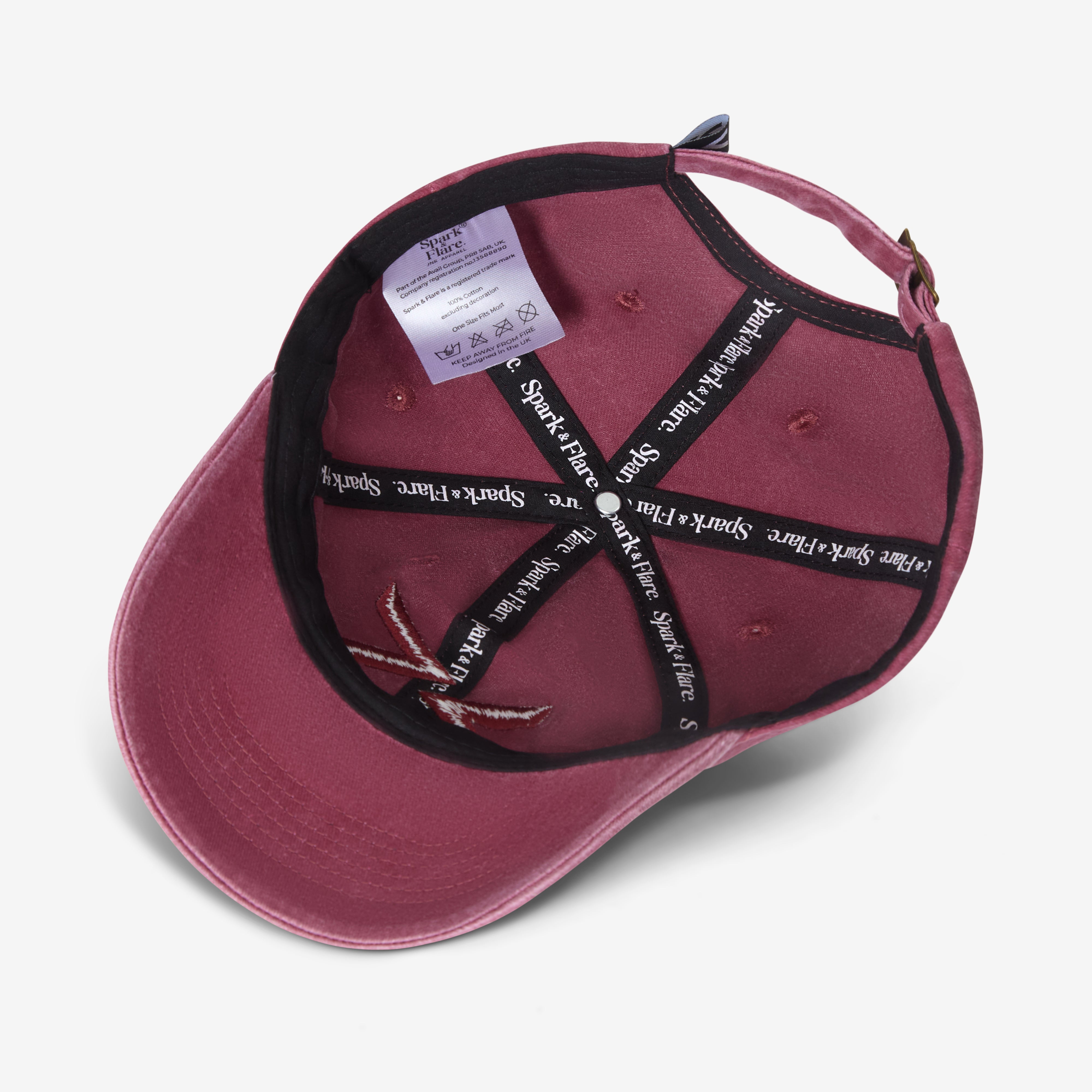 Inside a Washed red Spark & Flare baseball cap with branded lining