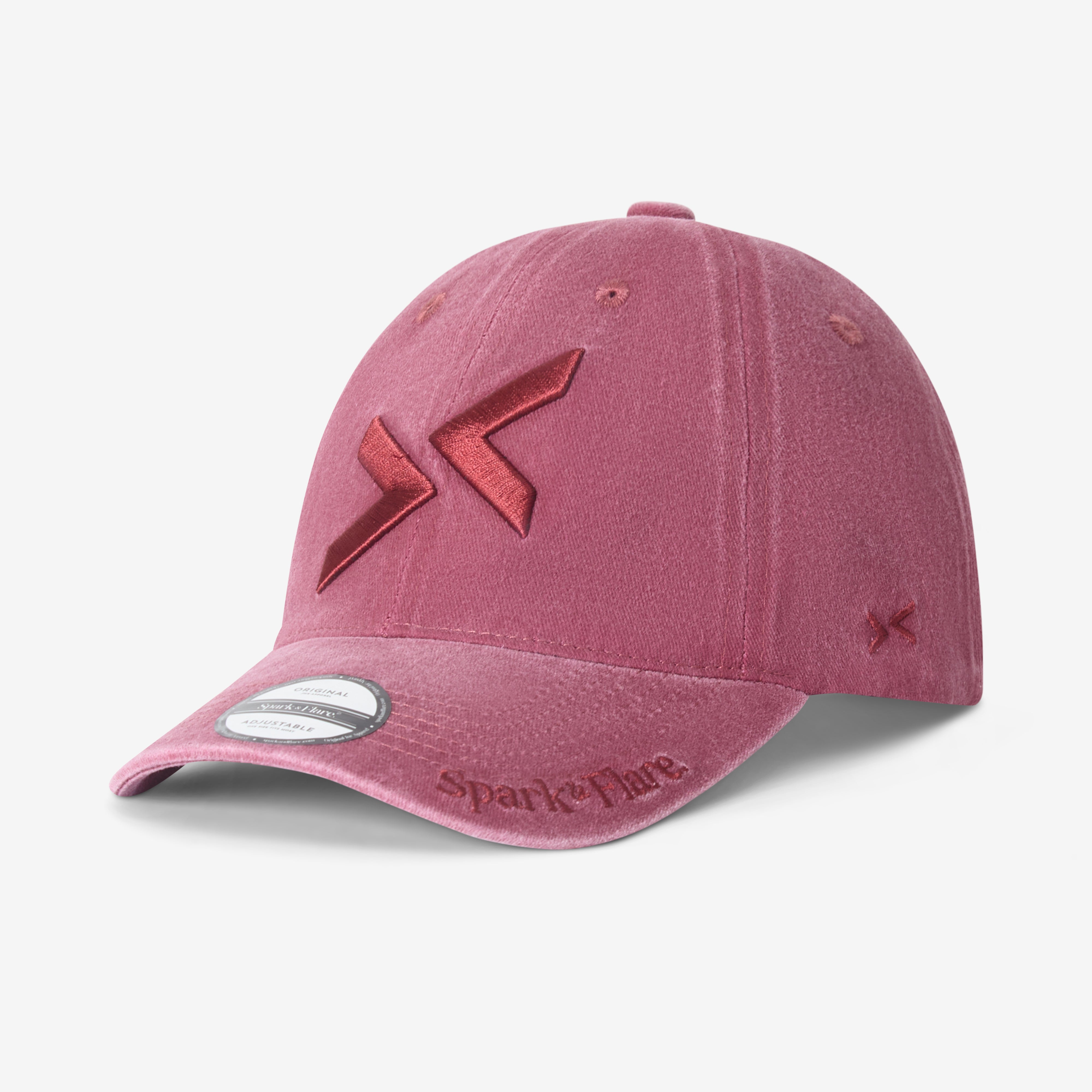 Washed red Spark & Flare baseball cap with matching coloured logo and Spark & Flare branding on visor