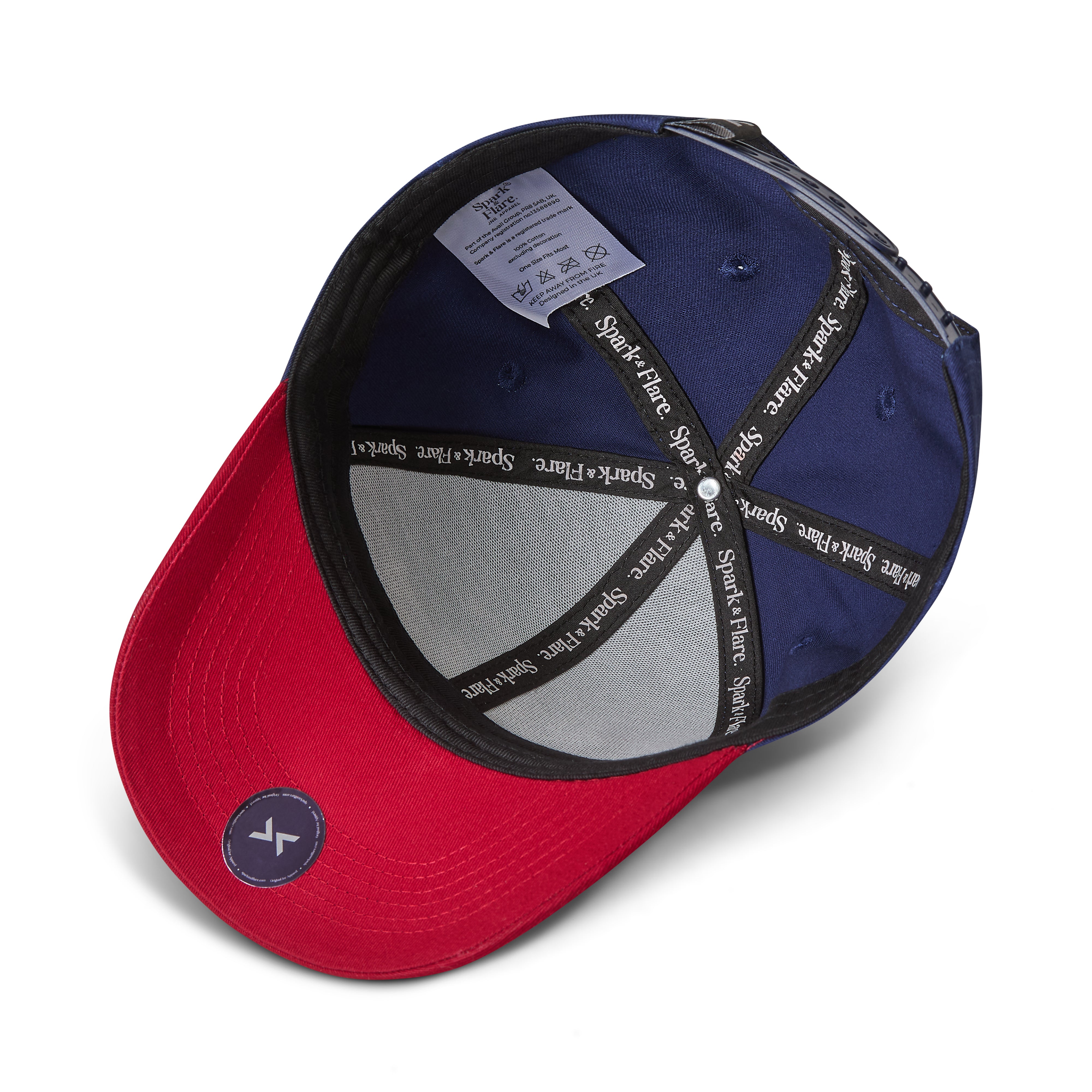 A red and navy blue snapback cap shown from an overhead angle, featuring a silver mesh back, black adjustable straps with white text, and a small circular authenticity sticker on the visor.